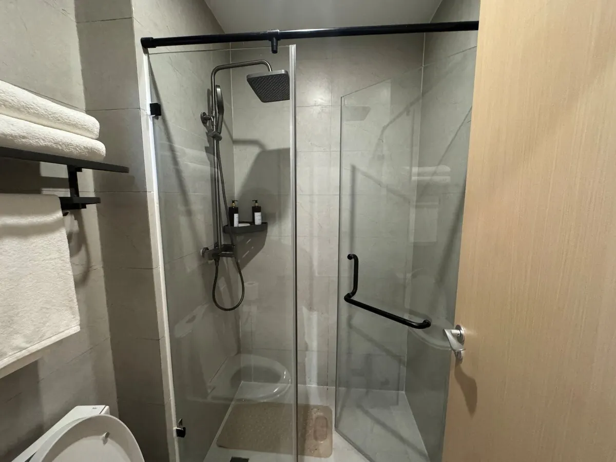 Glass shower with a rainfall head