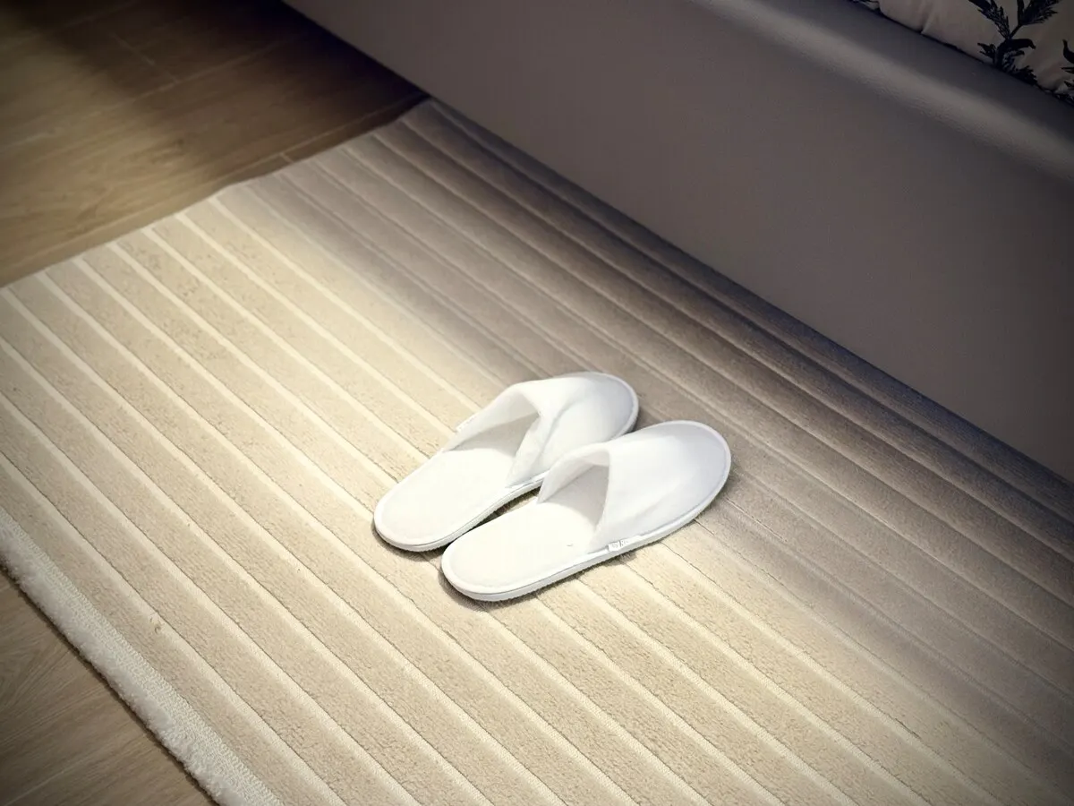Slippers waiting on the rug